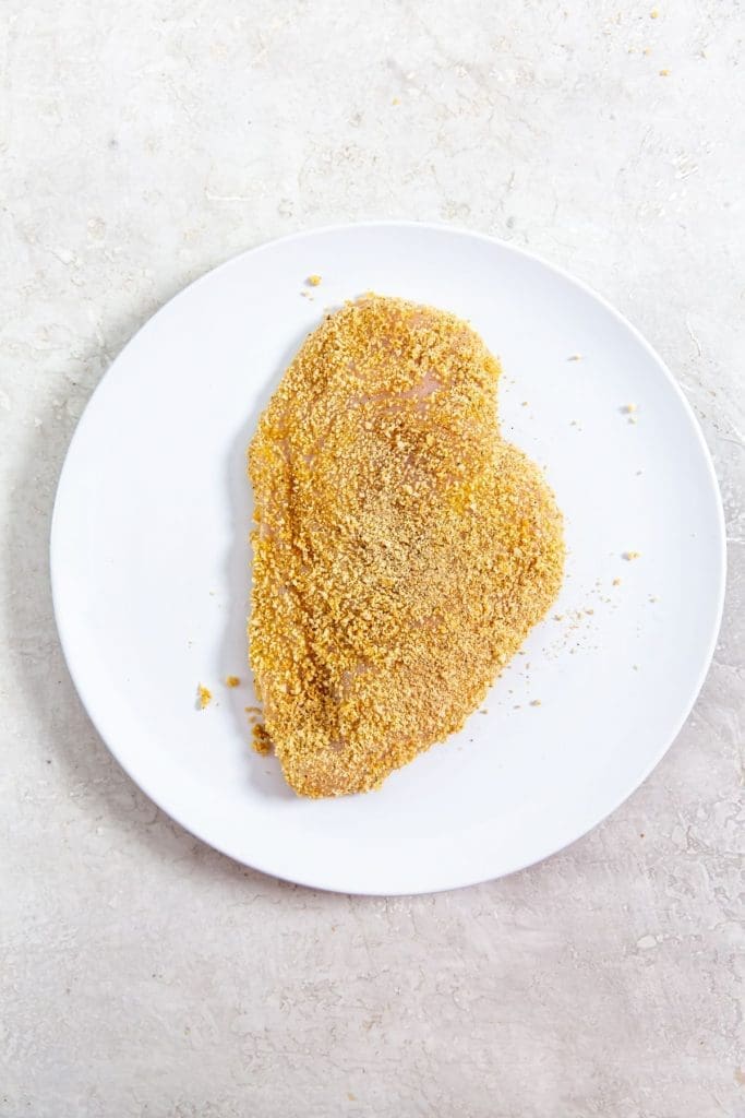 white plate with breaded chicken