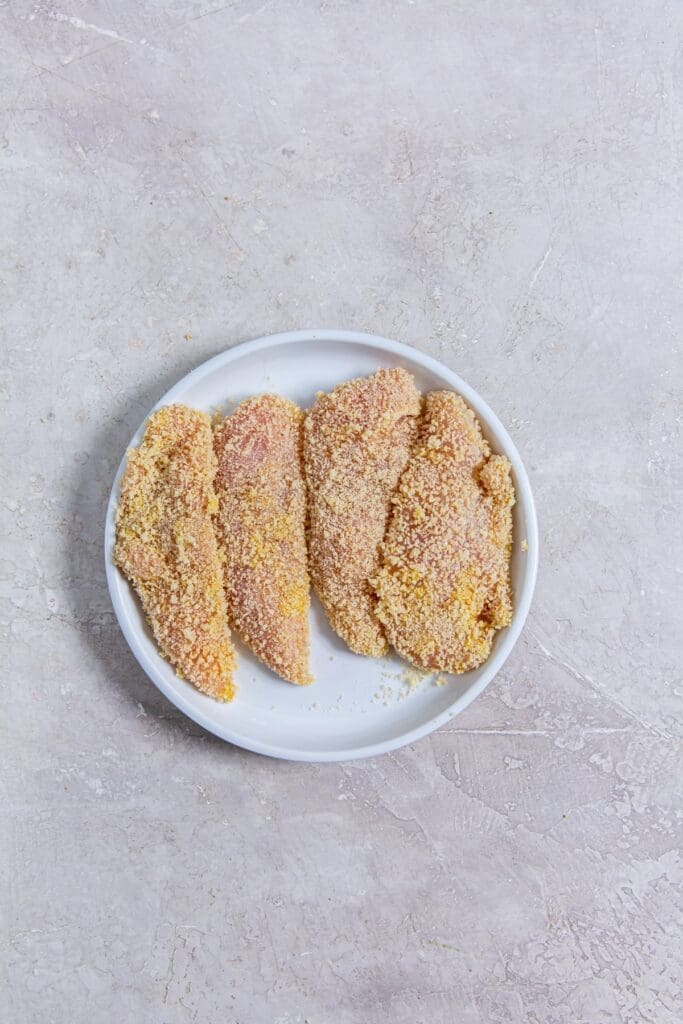 white plate with chicken on it