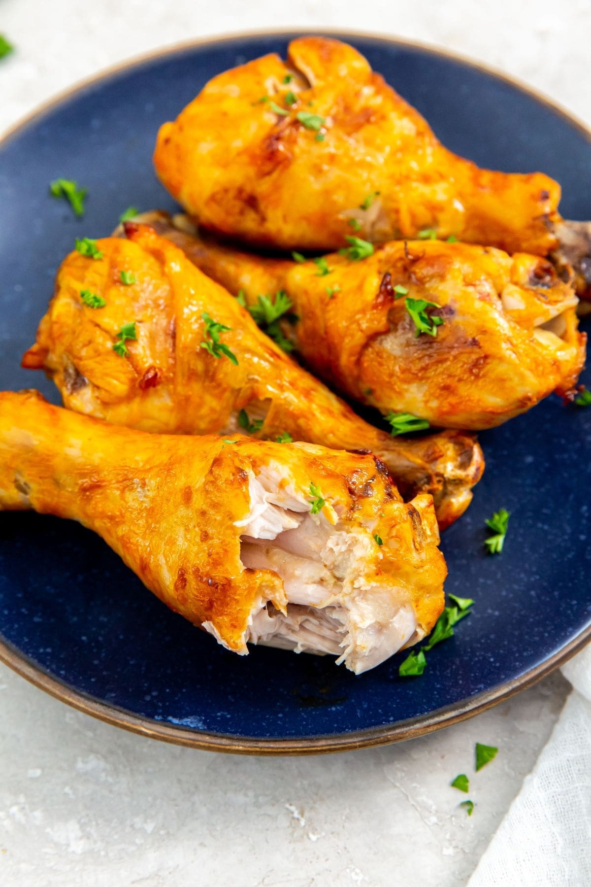 blue plate with chicken on it.