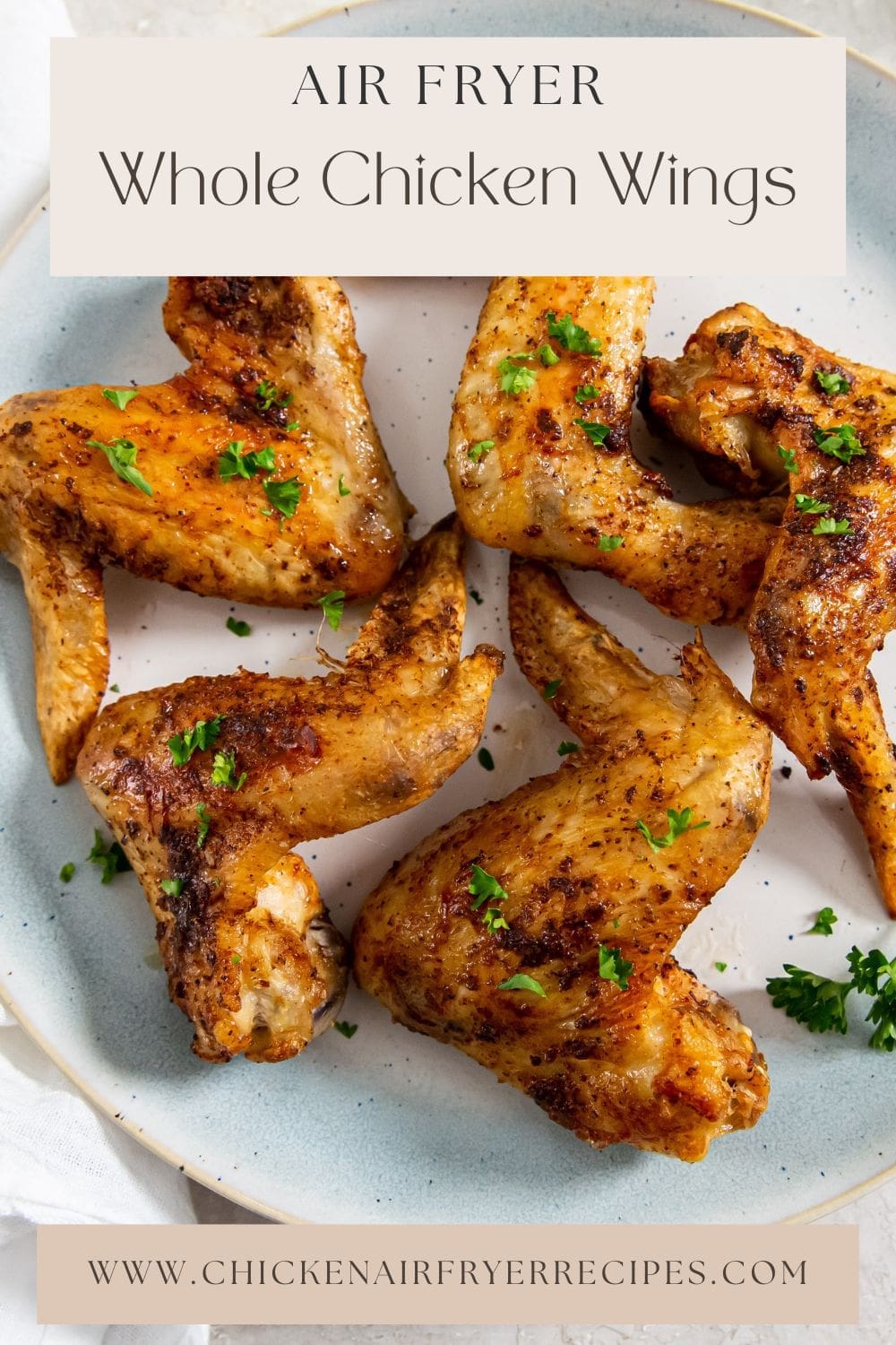 blue plate with chicken and parsley on it.