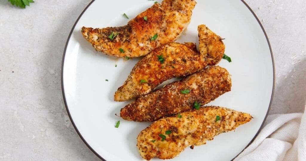 10 Air Fryer Chicken Recipes Blackened Chicken Tenders on a White Plate