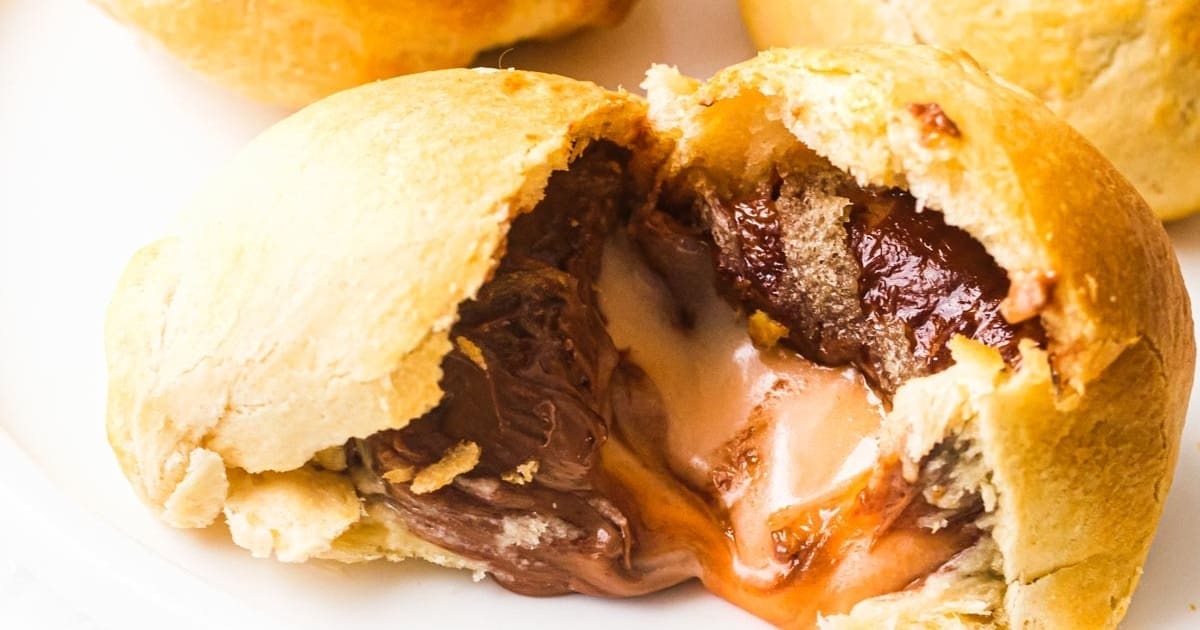 Air Fryer Easter Desserts Close Up of a Fried Cadbury Creme Egg Torn Open with the Chocolate Oozing Out