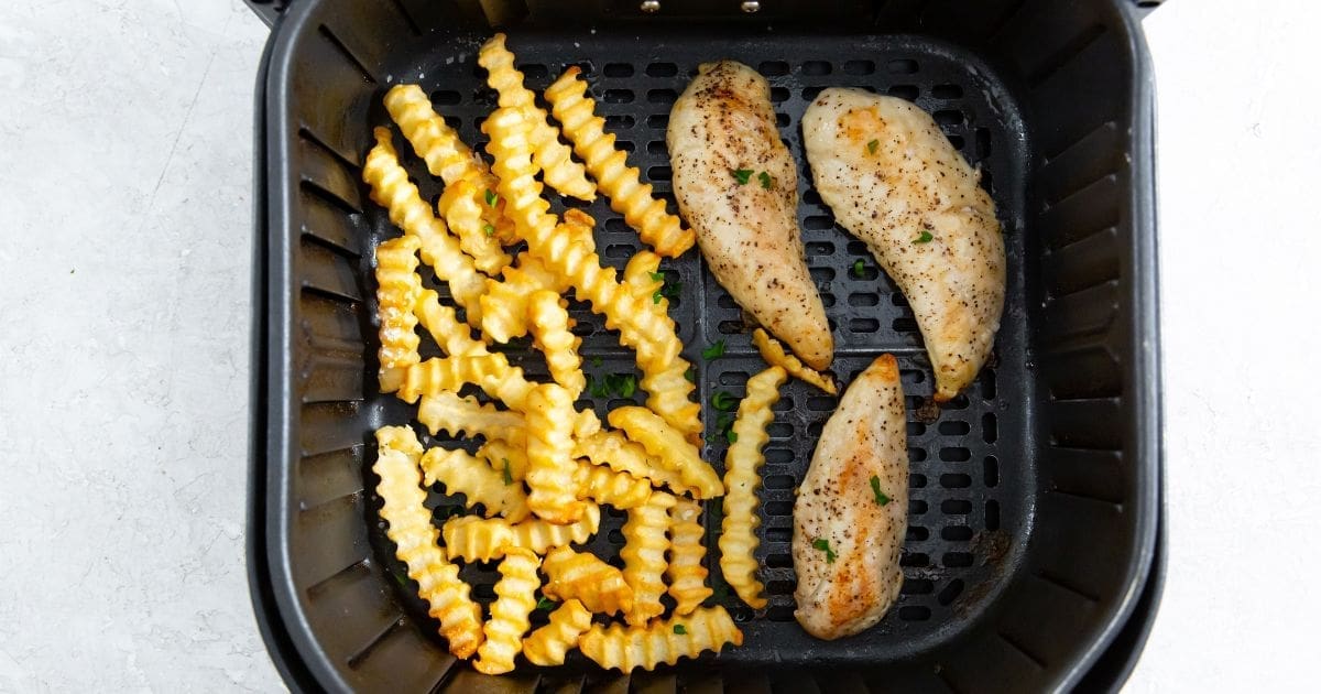 Chicken Recipes So Good an Air Fryer Basket of Air Fryer Chicken Tenders and Fries