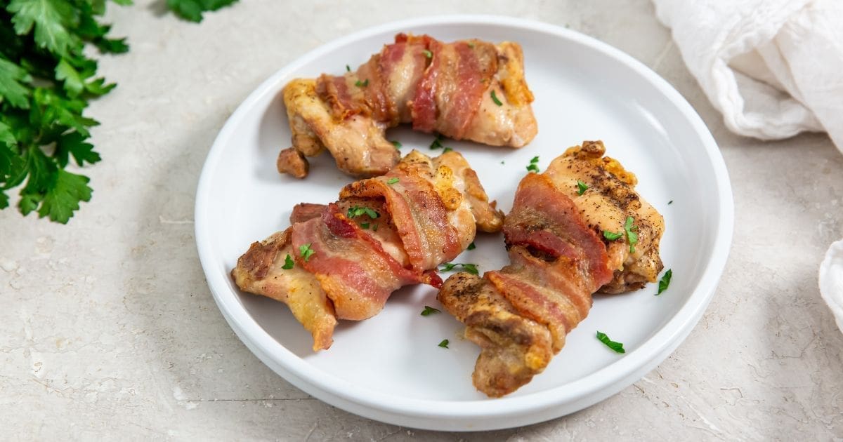 Chicken Recipes So Good a Plate of Easy Air Fryer Bacon Wrapped Chicken Thighs