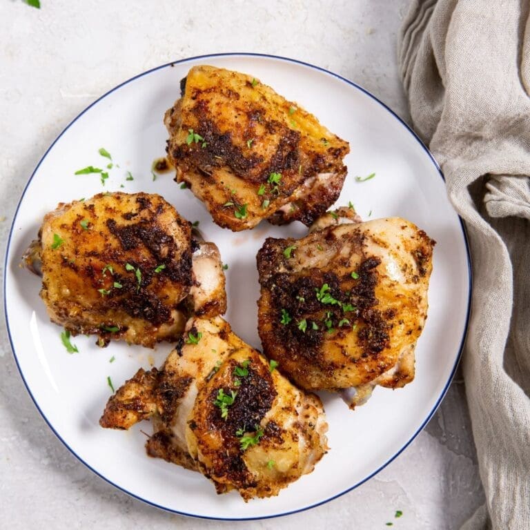 Air Fryer Recipes That Require Less Than 10 Minutes Prep a Plate of Cooked Chicken Thighs