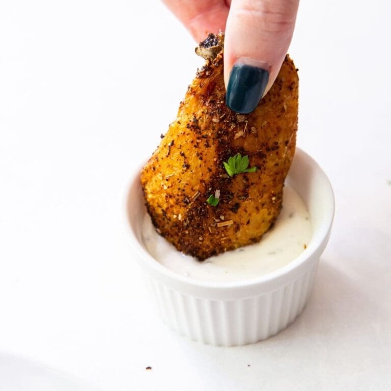 Frozen Chicken Wings in the Air Fryer Close Up of a Wing Being Dipped into Ranch