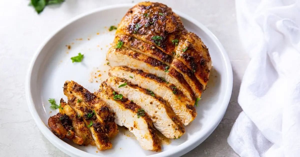 Air Fryer Chicken Recipes That Top Grandma’s Classics Half Sliced Air Fryer Blackened Chicken Breast on a Plate